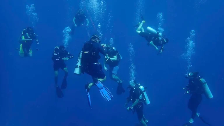 Group of divers doing a safety stop during a controlled scuba ascent